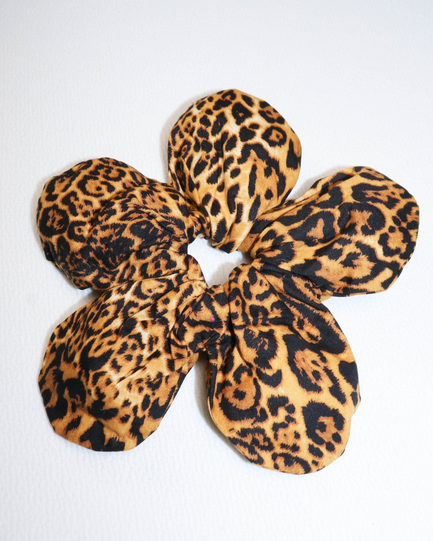 Leopard print scrunchie on a white background