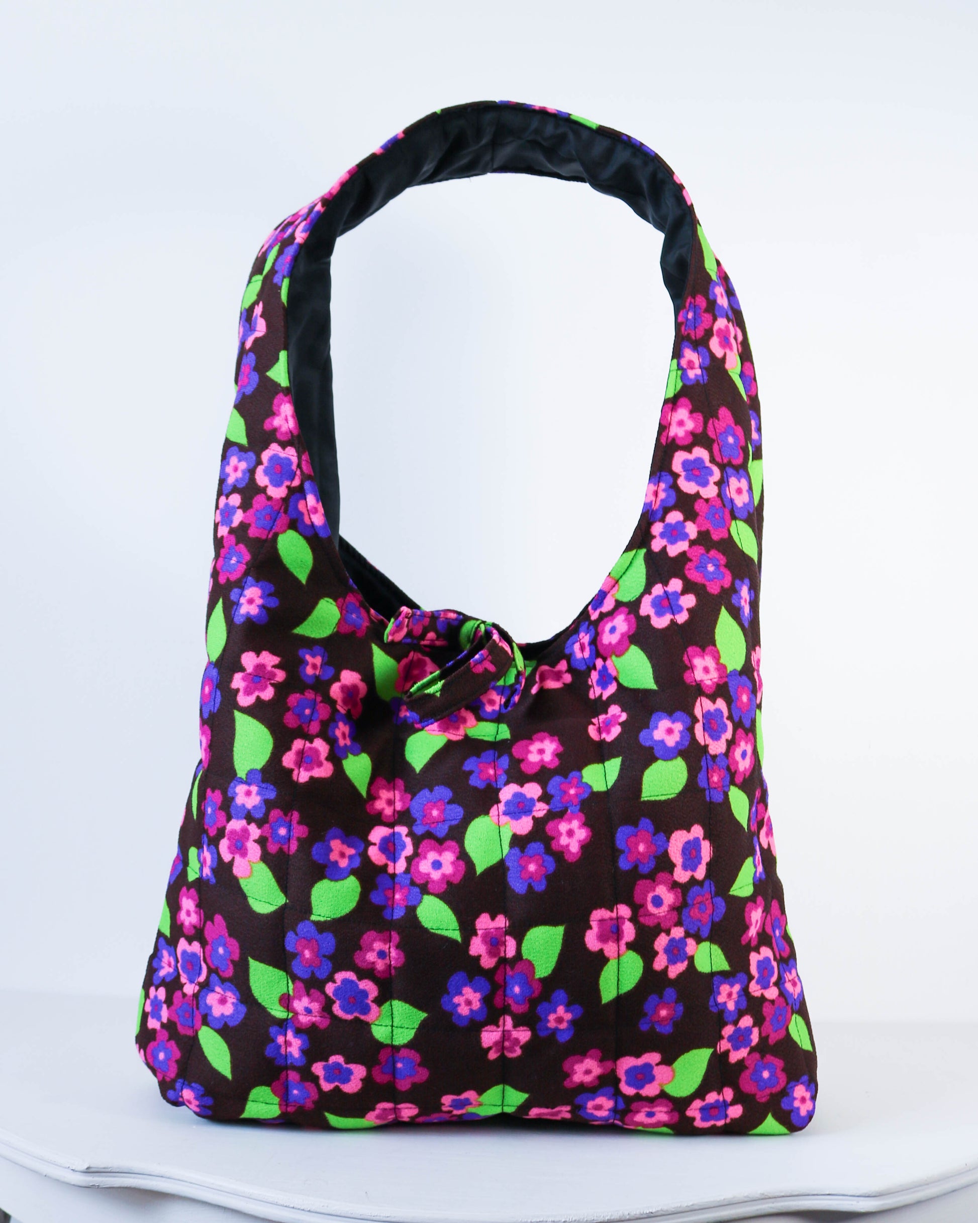Floral patterned bag on a white background