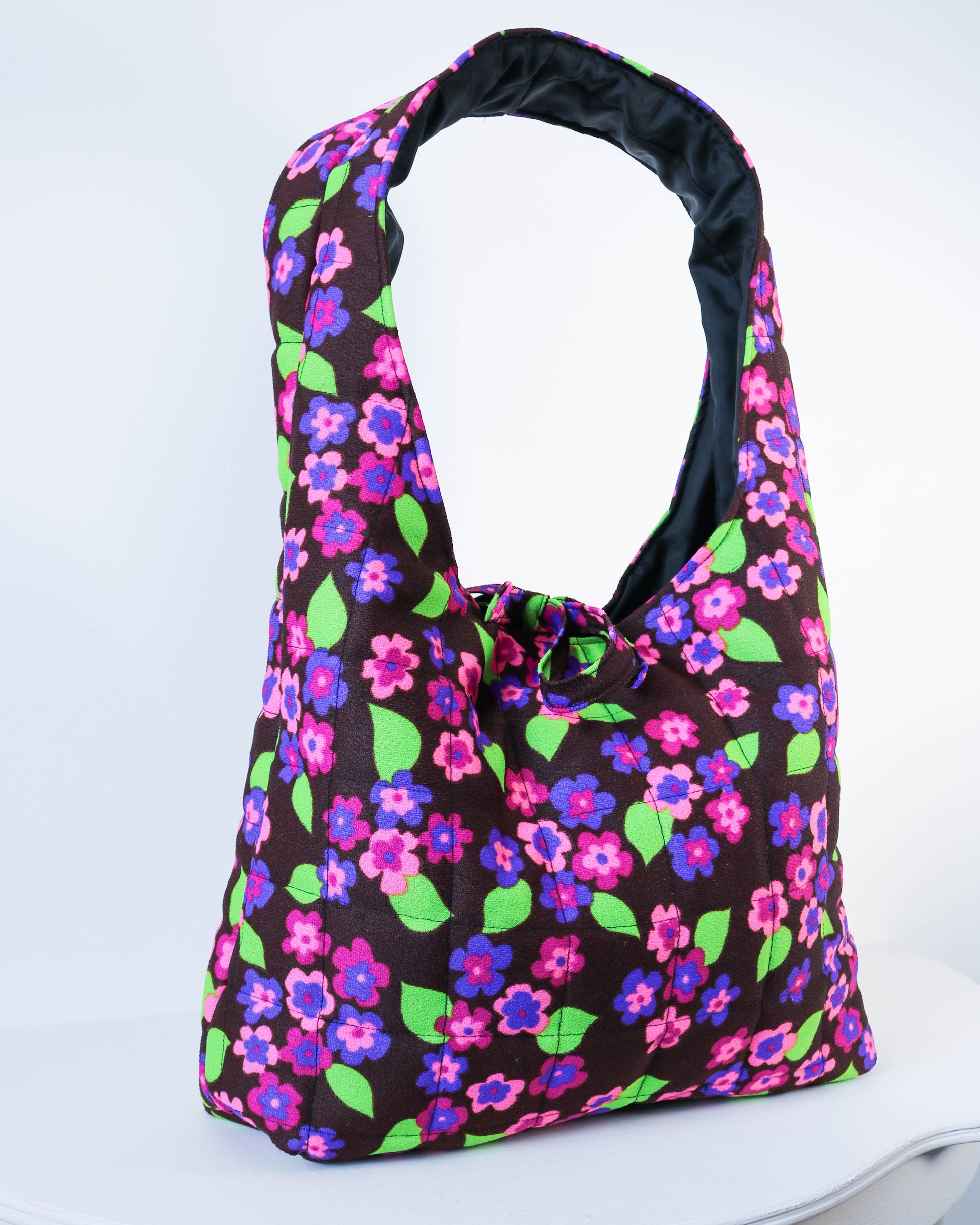 Floral-patterned bag on a white background