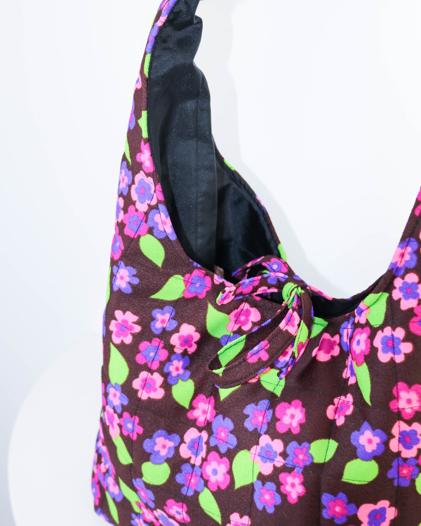 Floral patterned bag on a white background