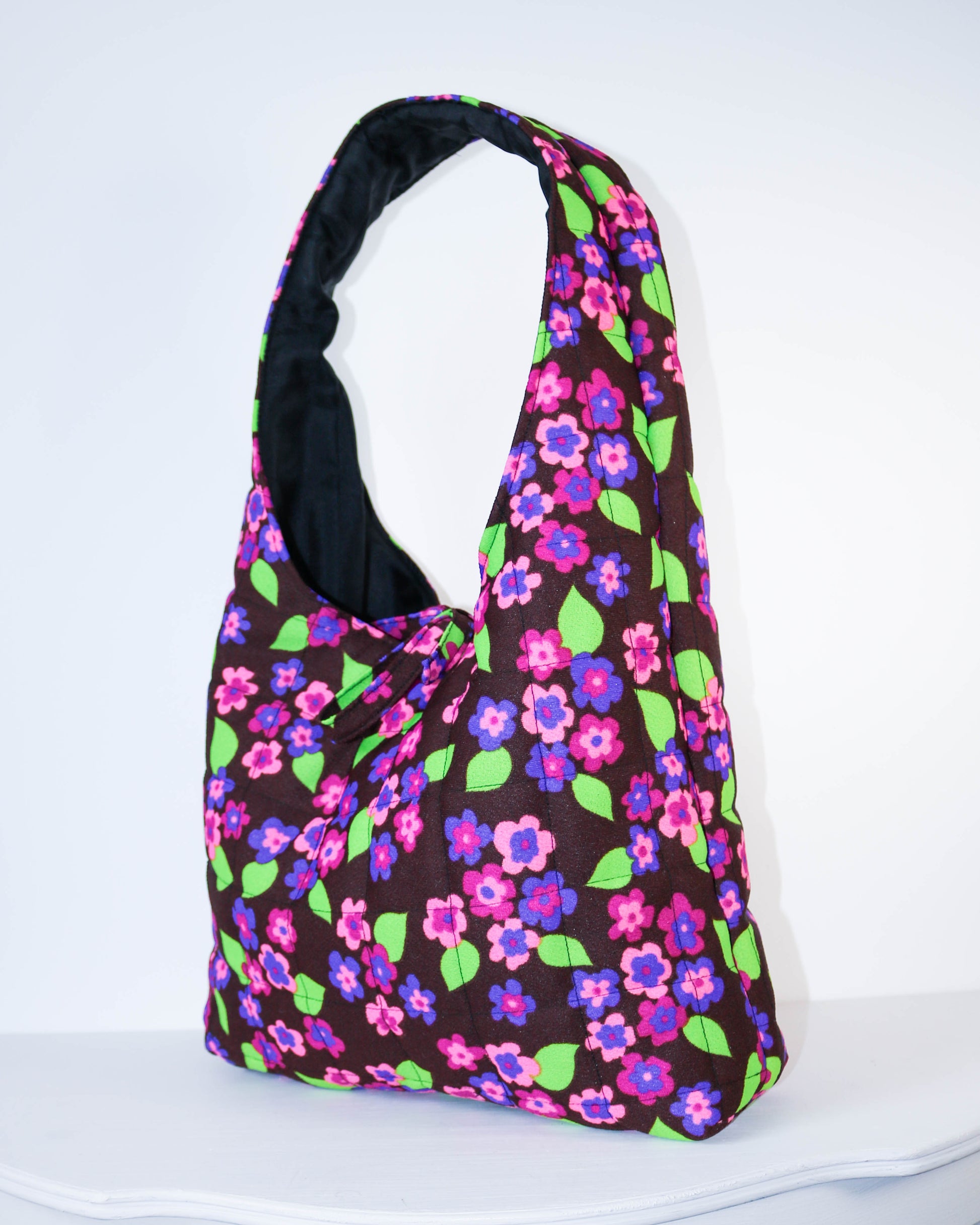 Floral patterned bag on a white background