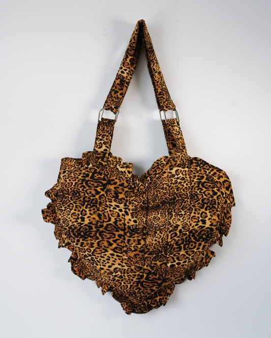 Leopard print handbag on a white background