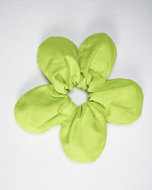 Green scrunchie on a white background