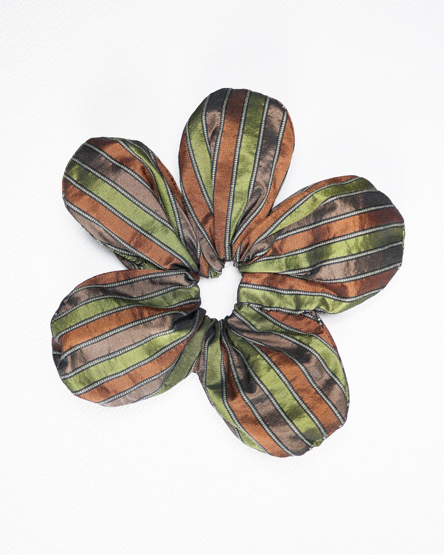Floral-patterned scrunchie with green, brown, and beige stripes on a white background