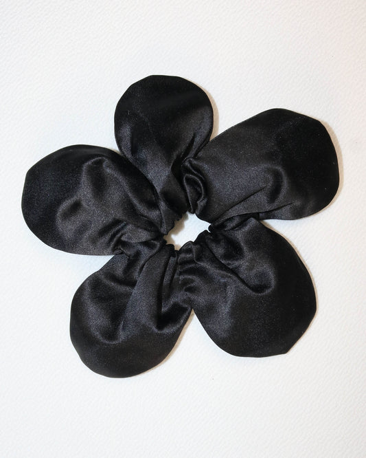 Black satin scrunchie on a white background