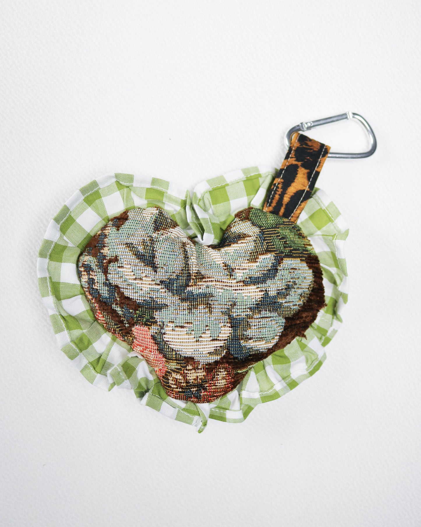Decorative keychain with snake design on a white background