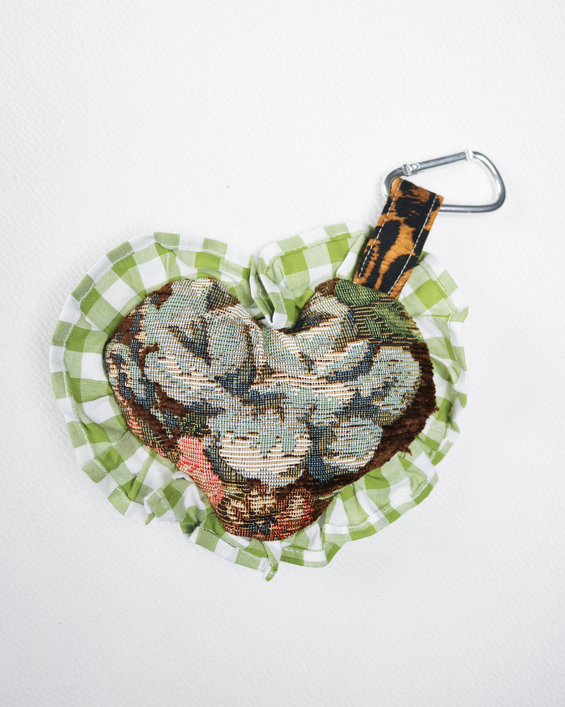 Decorative keychain with snake design on a white background