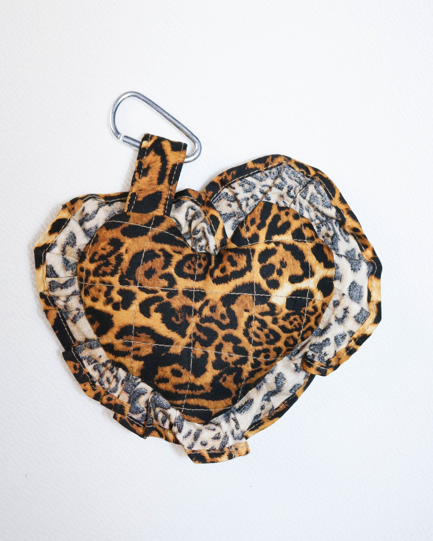 Leopard print key ring with a carabiner on a white background