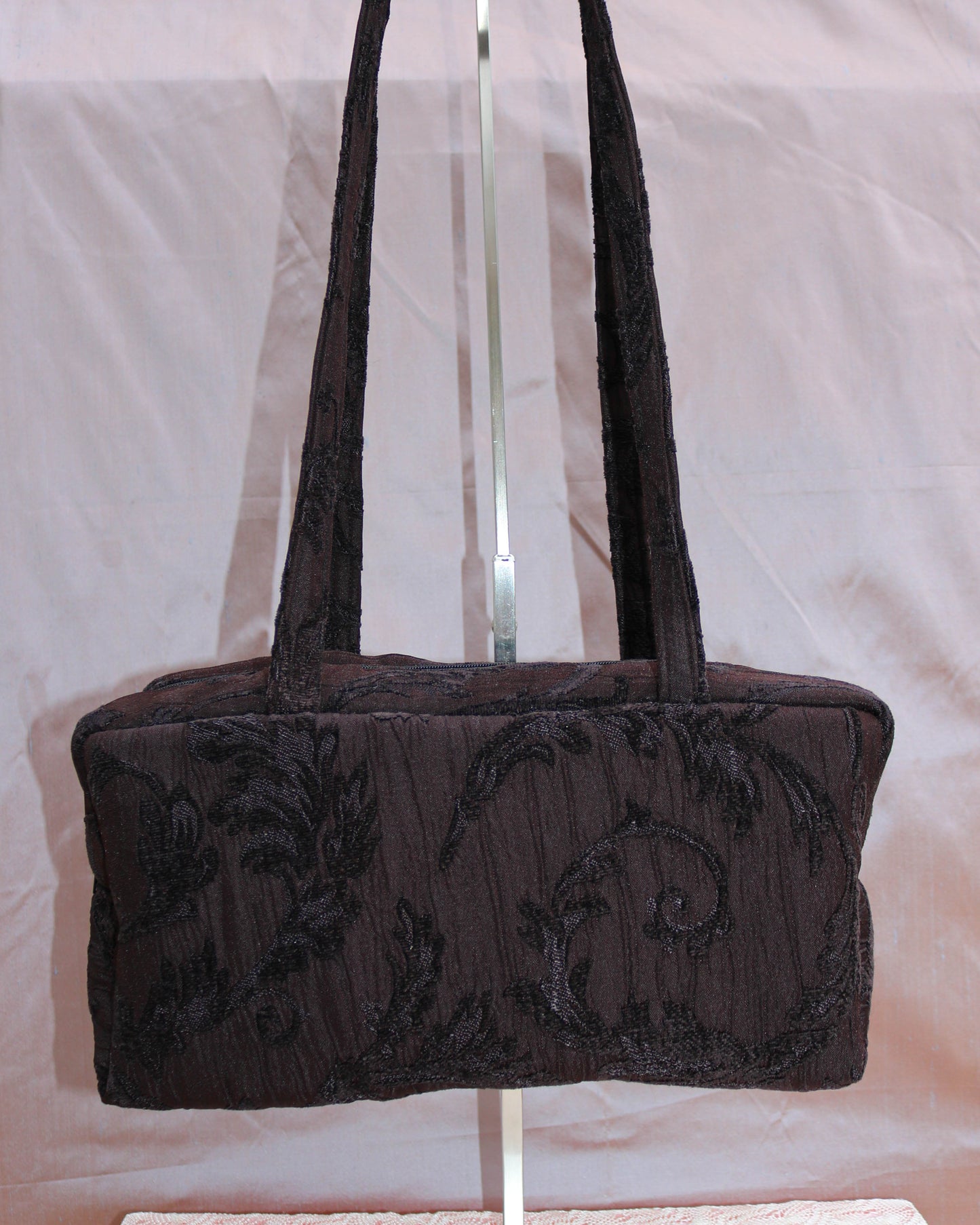 Black textured quilted bowler bag