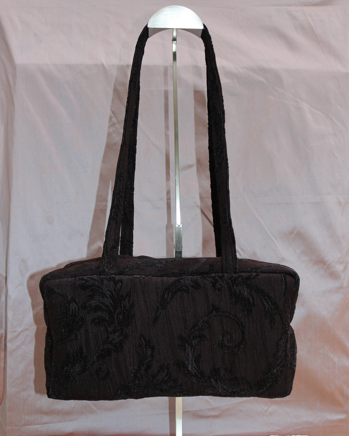 Black textured quilted bowler bag