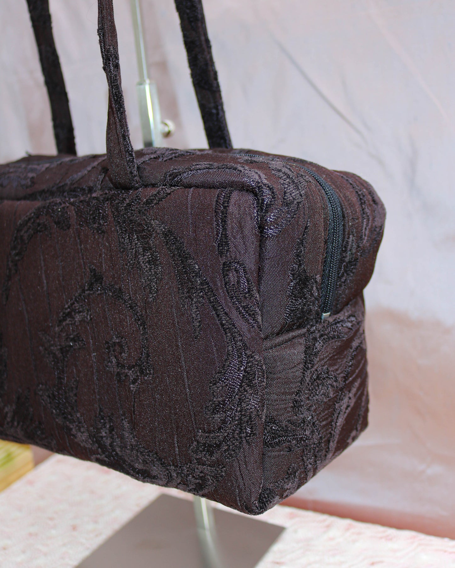 Black textured quilted bowler bag